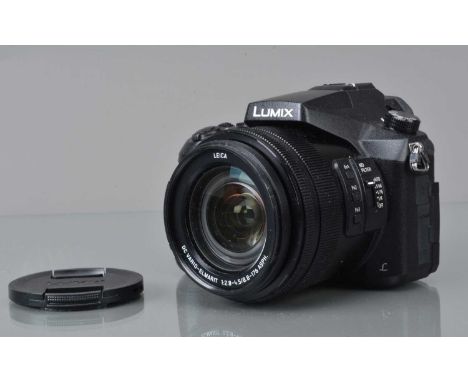 A Panasonic Lumix DMC-FZ2000 Digital Camera, powers up, shutter working, display working, appears to function as should, body