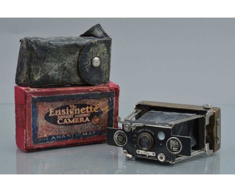 An Ensign Ensignette Folding Strut Camera, brass body, shutter working, body G, paint wear to front, bellows F-, elements G, 