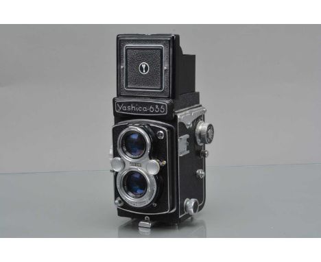 A Yashica 635 TLR Camera, shutter working, self timer working, body G, with Yashinon 80mm f/3.5 lens, elements F-G, some fung