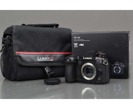 A Panasonic Lumix G9 Digital Camera Body, black, powers up, shutter working, display screen working, appears to function as s