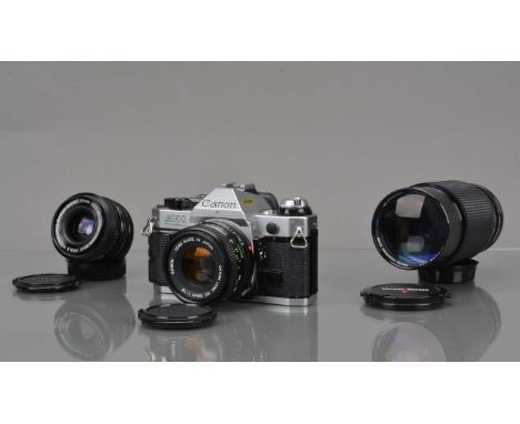 A Canon AE-1 Program SLR Camera, shutter working, meter responsive, camera responsive in program, self timer working, body G,