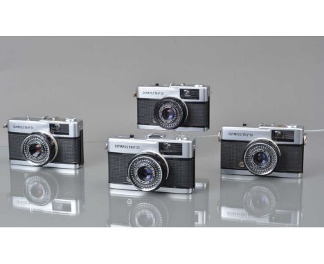 Four Olympus Trip 35 Compact Cameras, one silver button, shutters working, light cells/apertures responsive, bodies G, elemen