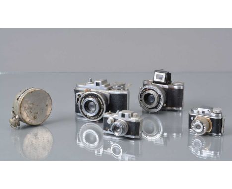 A Group of Miniature Cameras, a Houghtons Ticka pocket watch camera, heavy tarnishing to Nickel, shutter not working, Eljy Lu