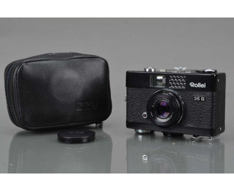 A Rollei 35 B Compact Camera, black, made in Singapore, shutter working. Light cell responsive, body G-VG, with Rollei 40mm f