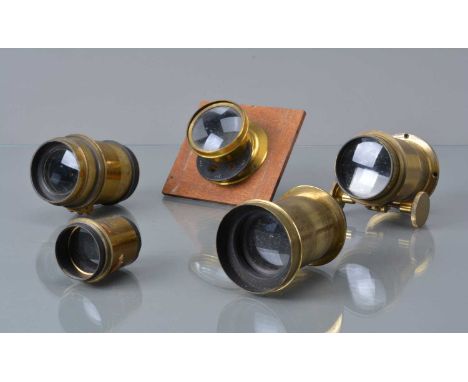 A Group of Brass Lenses, a Perkin Son & Rayment Rapid Rectiliner 5x7 Optimos waterhouse stop lens, unmarked brass lens, with 