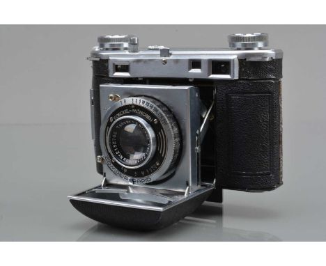 A Certo Super Dollina Folding Camera, serial no 27610, shutter working, rangefinder working, body G, with Carl Zeiss Jena 5cm