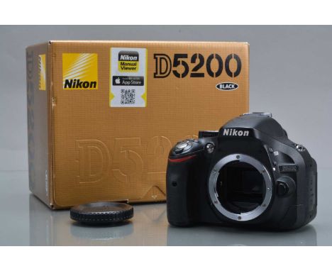 A Nikon D5200 DSLR Camera Body, shutter working, display working, flash working, body G, light wear, with MH-24 charger, two 