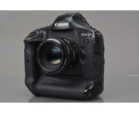 A Canon EOS-1D X DSLR Camera Body, shutter working, displays working, body F-d, scratches to top & top edges, with EF 50mm f/