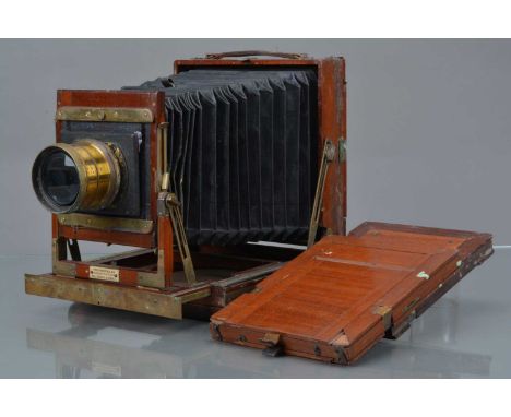 A Thorton Pickard Imperial Triple Extension Mahogany & Brass Half Plate Camera Body,  with replacement base, some tarnishing 