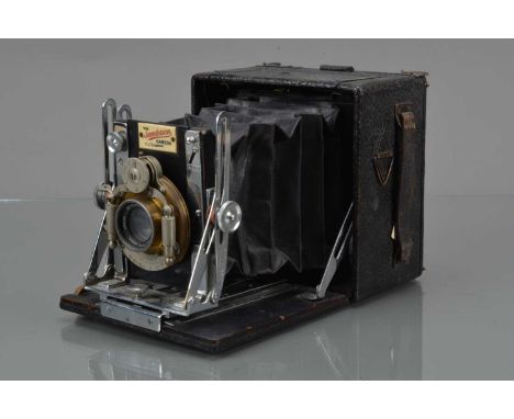 A Sanderson Regular Hand & Stand 3¼ x 4¼'' Camera, serial no 2277, ebonised wood & chrome, body F, folding bed catch loose, s