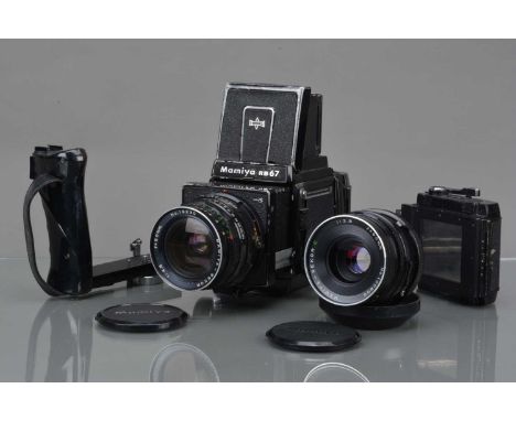 A Mamiya RB67 Professional S Camera, serial no C115662, shutter working, body F, paint wear/scratches to edges, some lifting 