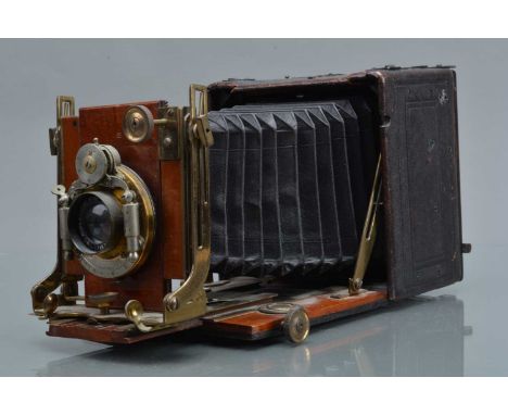 A Quarter Plate Folding Bed Camera, body F, pin holes to sides, bellows G, with The Houghton Envelope adapter back, Alidis Se