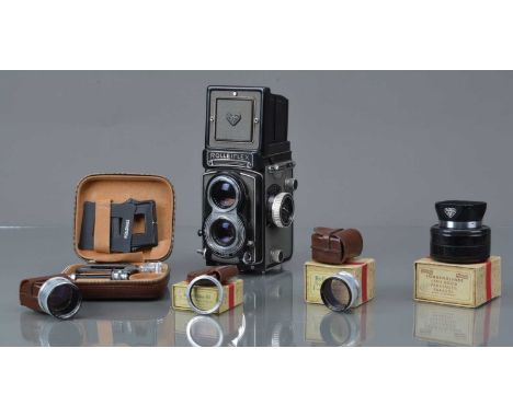 A Rolleiflex 3.5T TLR Camera,  grey, type 1, serial no T 2138188, shutter sluggish in slow speeds, body G, with Carl Zeiss 75