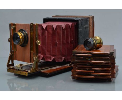 A Half Plate Folding Bed Camera, body G, red bellows F-G, back adapted to fit a Kodak half plate back, with Taylor  & Hobson 