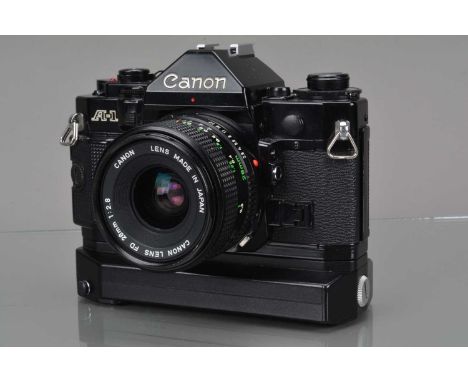 A Canon A-1 SLR Camera, black, shutter working, meter working, camera responsive, self timer working, body G-VG, with FD 28mm