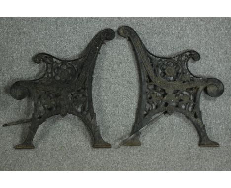 A pair of Victorian cast iron bench ends. Each measuring H.80 W.68 cm. 