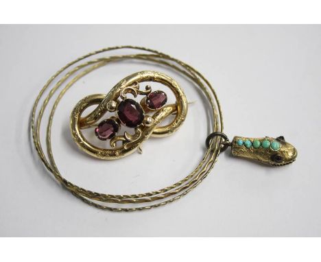 Gilt metal snakehead bangle and a brooch