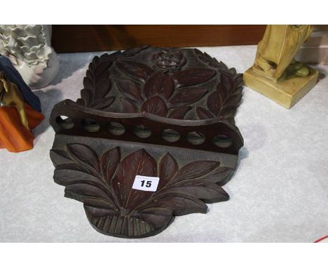 Carved oak pipe rack