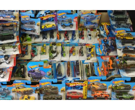 Hot Wheels - 68 Carded Mattel Hot Wheels to include Hyper Striker, Then and Now, Tooned, Baja Blazers, HW Hot Trucks, HW Resc