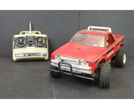 A Tamiya Subaru Brat 58038 1/10 scale electric offroad pickup truck c.1983 with a good condition high impact sterol original 