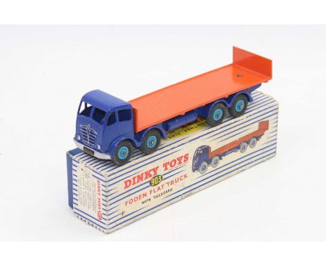 A Dinky Toys No. 903 Foden flat truck with tailboard comprising of a 2nd type dark blue cab and chassis with dark orange back