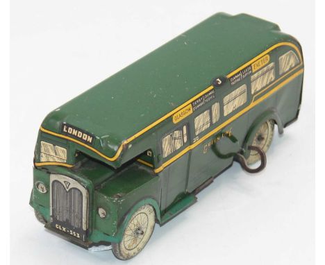 Wells Brimtoy tinplate clockwork Greenline Bus - dark green with yellow trim, tinprinted window detail, the clockwork mechani