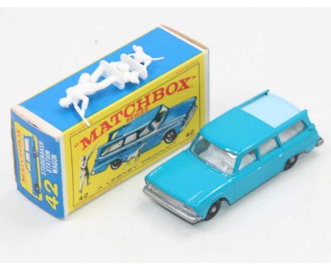A boxed Matchbox no.42 Studebaker Station wagon in dark blue with light blue metal slide roof,(one small chip, otherwise mint