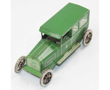 Lehmann No.765 Sedan, tinplate and clockwork model finished in green and cream, single fixed key mechanism in working order, 
