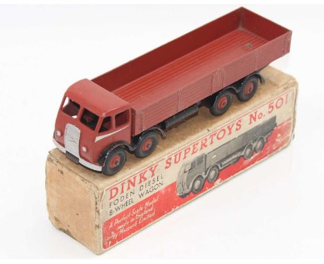 A boxed Dinky Toys No. 501 Foden 8-wheel wagon comprising of first type cab finished in brown and black, with matching hubs a