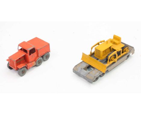 An original Moko Lesney Matchbox Prime Mover in orange, missing engine covers and trailer in tan, missing towing rod and a la