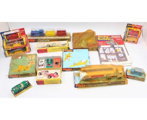 A group of mixed boxed and unboxed late issue Dinky Toys to include 945 AEC "Esso" tanker,342 Austin Mini Moke, 225 Lotus rac