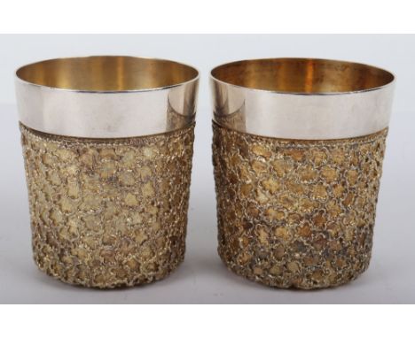 A pair of Stuart Devlin beakers, 1978, the bodies with gilt textured effect, gilt interior, 9cmHx8.5cmDiam, 602g