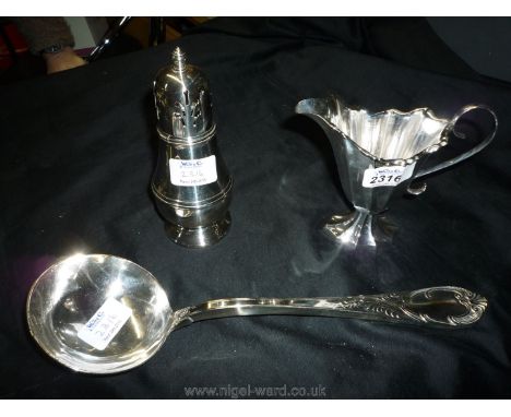 A white metal Sugar Castor, 6'' tall plus a large soup Serving Ladle, 19thc., 12'' long and an interesting ten panel pedestal