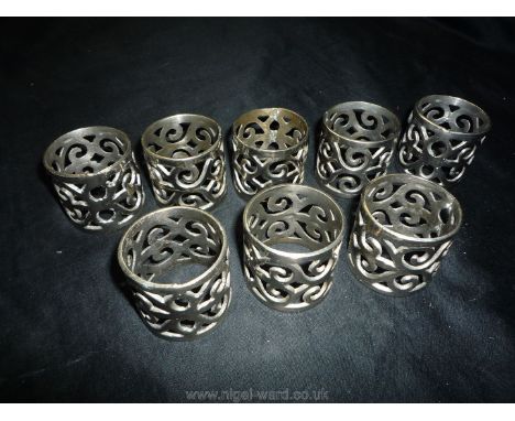 A Set of Eight Studio made Celtic pierced Napkin Rings.