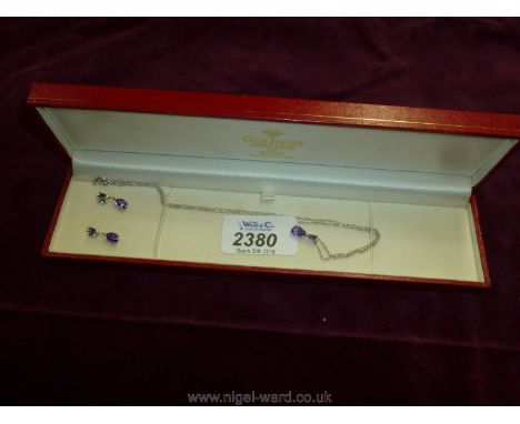 A sterling Silver Amethyst Pendant and Earrings