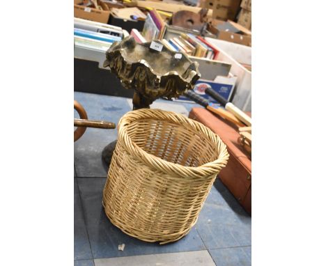 A Cast Plaster Figural Garden Planter in the Form of a Cherub and a Wicker Waste Basket 