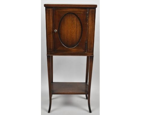 A Pretty Edwardian Inlaid Cabinet with Base Shelf, on Splayed Square Tapering Supports, 30cm wide and 72.5cm high 