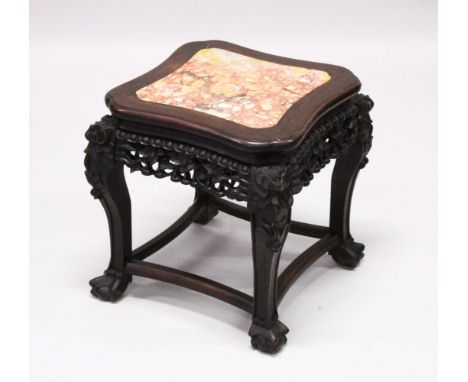 A GOOD 19TH CENTURY CHINESE HARDWOOD &amp; MARBLE PLANT STAND, the top inset with marble, the frieze carved to depict foliage