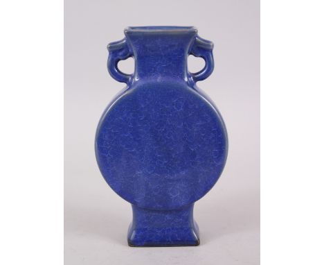 A 20TH CENTURY CHINESE COBALT BLUE CRACKLE GLAZE TWIN HANDLE MOON FLASK, the base bearing a six-character mark, 22cm high x 1