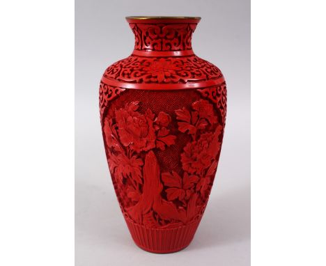 A 20TH CENTURY CHINESE CINNABAR LACQUER VASE, with carved floral decoration and formal scroll,23cm high.