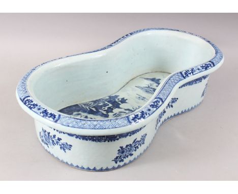 AN 18TH CENTURY CHINESE BLUE AND WHITE PORCELAIN BASIN / BIDET, decorated with landscape scenes, 60cm x 35cm