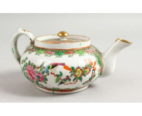 A CHINESE 19TH CENTURY CANTON TEAPOT AND COVER, 19cm wide including handle and spout.