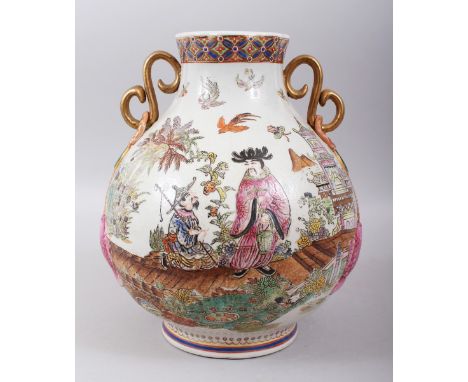 A 20TH CENTURY CHINESE / HONG KONG PORCELAIN TWIN HANDLE VASE, decorated with twin gilded handles with moulded carp to the si