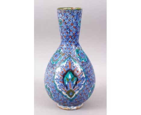 A GOOD 19TH CENTURY OR EARLIER IZNIK TYPE CERAMIC VASE, the body with floral decoration, 29cm high x 15cm wide.
