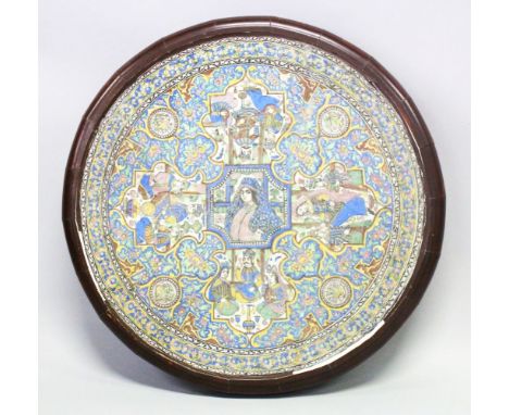 A VERY GOOD 19TH CENTURY PERSIAN QAJAR CIRCULAR TILE / TABLE, the tile depicting various scenes of figures within panels surr