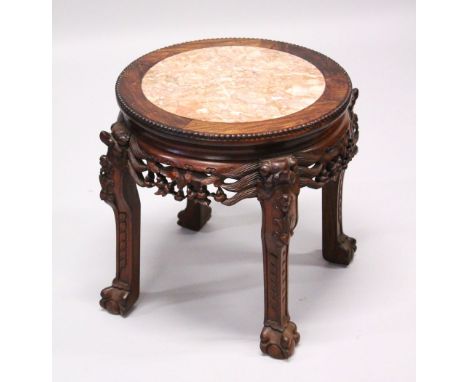 A GOOD 19TH CENTURY CHINESE HARDWOOD MARBLE TOP PLANT STAND, the top inset with marble, the frieze carved to depict foliage a