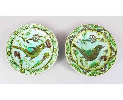 TWO GOOD 17TH CENTURY OTTOMAN IZNIK CERAMIC DISHES, both the dishes decorated with scenes of birds, 24.5cm cm diameter each.