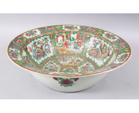 A LARGE 19TH CENTURY CHINESE CANTON FAMILLE ROSE PORCELAIN BASIN, decorated with panels of figures both interior and within l