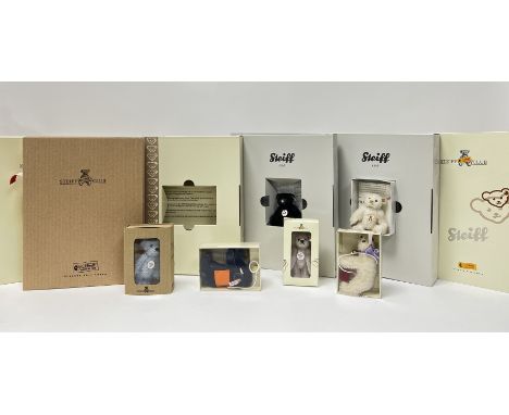 A collection of Steiff Club membership annual miniature mohair bears comprising, a 2004 light blue fully jointed bear (h. 7cm