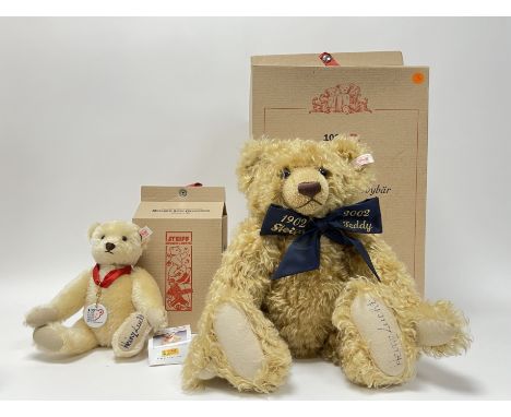 A large Steiff blonde mohair centenary bear with a navy satin bow with embroidered inscription and foot stamp, with certifica